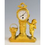 French gilt metal clock, the clock supported on a pillar flanked by a cherub and a basket of