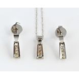 Diamond drop earrings and pendant set, four graduated princess cut diamonds, channel set in pendant,