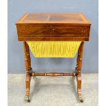 Early 19th century rosewood work table, the hinged top enclosing a fitted interior and work