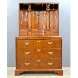 18th century style walnut cabinet on chest, the top with pigeon holes to four cupboard doors all