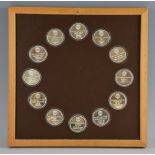 Franklin Mint,The treasures of the Aztec set of twelve medals, in silver with gold detail, mounted