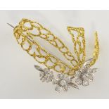 1970's gold and diamond brooch, three graduated diamond set flowers, set with round brilliant and