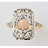 Opal and diamond set plaque ring set with central cabochon opal and small brilliant cut diamonds