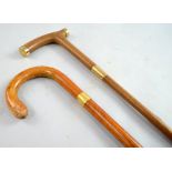 19th Century walking cane with 9ct gold mounts - 90 cm. Another with 9ct collar - 81 cm .