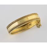 Victorian gold hinged bangle, with wire work decoration, and safety chain, in unmarked gold