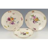 Pair of 19th century Meissen plates painted with bouquets of flowers within basket weave shaped