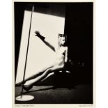 Howard Schatz (American, b. 1940). 'Sonya'. Bromide print of a seated nude woman by a window. Signed