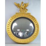 Regency convex gilt wood circular wall mirror with eagle surmount 96cm high 44cm diameter.