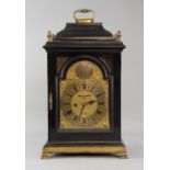 18th century ebonised bracket clock, the silvered chapter with Roman and Arabic numerals, and date