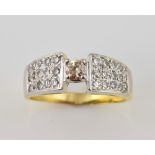 Diamond set cocktail ring, central diamond and pave set shoulders in white and yellow gold,