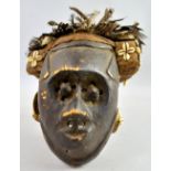 A 20th century Pwoom Itok mask, Kuba, D.R. Congo, carved wood with woven head-piece, decorated