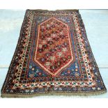 Persian style red ground carpet, lozenge shape central medallion, repeated stylised border, 168 x