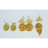 Collection of Victorian gilt metal earrings, including oval drops with floral pattern, and hook