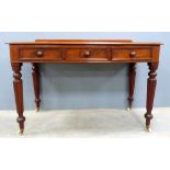 19th century mahogany side table with three drawers on reeded turned legs, 75 x 120 cm . casters