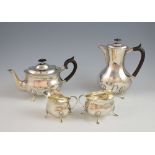 George V silver tea service of plain form, comprising tea pot, hot water jug, sugar bowl and cream