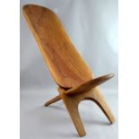 African birthing chair, the tall back carved with an armadillo and knife, 128 cm high PROVENANCE: