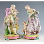 Pair of Dresden figures of a Man and a Woman with cherubs on round bases - 36 cm .