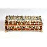 Early 20th century Indian tortoiseshell, ivory and bone mounted sandalwood box, on four lion's paw