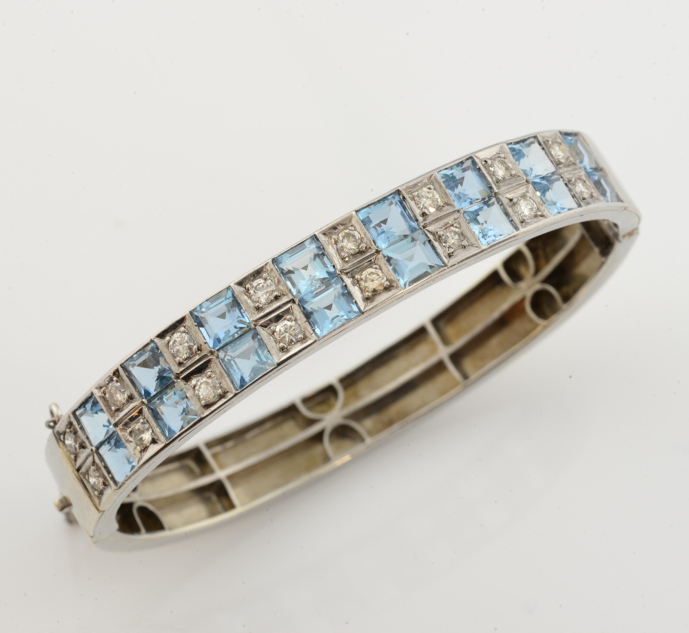 Aquamarine and diamond oval bangle, sixteen square cut aquamarines, estimated total weight 4.65