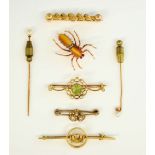 Six Victorian and later gold brooches, a double heart seed pearl set brooch, another with peridot, a
