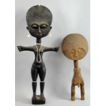 Two wooden Akua'ba figures, one female decorated with white beaded jewellery, 50 cm high, the