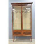 Early 20th century mahogany and box wood strung astragal glazed display cabinet on square legs to