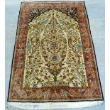 Persian cream ground silk rug decorated with birds, foliage and flowers, multiple borders, 175cm x