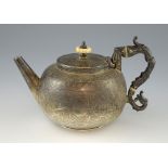 Victorian silver tea pot engraved throughout with floral and geometric patterns, on round foot, by W