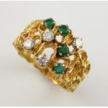 Emerald and diamond abstract design ring, four round cut emeralds, and four round brilliant cut