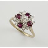 Vintage ruby and diamond cluster ring, central round brilliant cut diamond, estimated weight 0.42