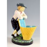 Minton majolica figure modelled as a boy leaning on a grape basket, model no. 421, impressed marks