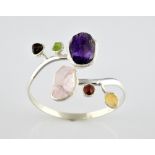 Contemporary rough stone twist bangle, set with large rough cut rose quartz and amethyst, with
