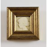 Early 20th century carved ivory plaque of a young girl, signed with a monogram TE, 3 x 3cmPLEASE