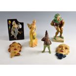 A group of Art Deco items, to include a pair of wall masks, a Wade Grace figurine, a terracotta