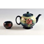 Moorcroft spring flowers teapot, inscribed and painted signature and Potter to the Queen stamped