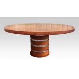 Georgio collection, a contemporary circular table with sectional cut oak top on single drum column