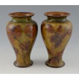 Doulton, a pair of ovoid stoneware vases, impressed with leaf pattern, impressed Doulton marks and