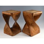 Two hardwood twist design side tables, 40cm high.