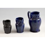 Farnham Pottery, Surrey, three owl jugs, 12cm, 9cm and 8cm high . Largest jug stamped marks for