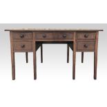 Cotswold School walnut kneehole desk, attributed to Peter Waals, six drawers, with octagonal