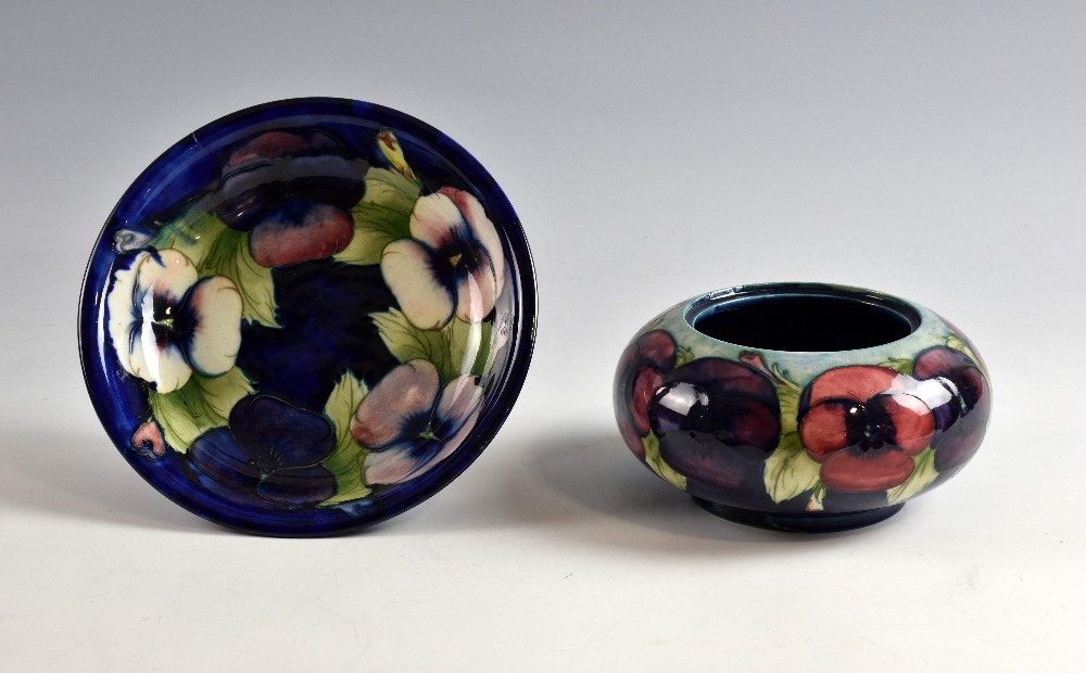 Moorcroft pansy bowl, pale pink to mauve flowers on a blue ground, impressed signature and Potter to