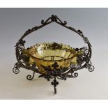 An Art Deco glass and wrought iron mounted centrepiece, with barley twist handles and all over