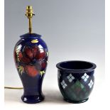 Moorcroft anemone pattern lamp base with deep red flowers on a blue ground, impressed marks, total