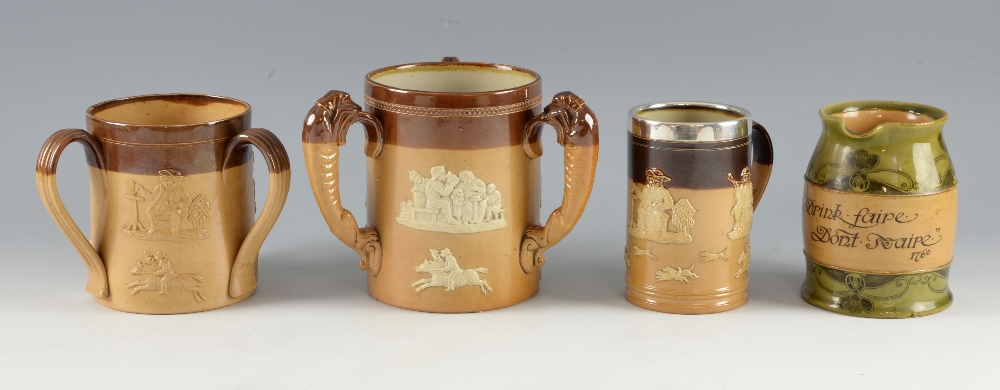 Doulton stoneware, a large harvest ware loving cup with dog handles, similar with strap handles, mug