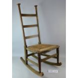 Voysey chair with rush seat and fixed Liberty's label and another chair..