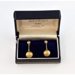 Stuart Devlin, a pair of gold earrings, textured gold globular forms suspended on a bar, box by