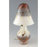 Studio glass mushroom table lamp the mottled ground with trailed decoration, signed indistinctly