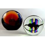 Two Murano glass sculptures, each a flattened sphere of coloured glass, 34 cm and 27 cm high, (2).