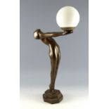 Table lamp in Art Deco style modelled as a nude supporting a globe, plaster with bronze finish 55cm