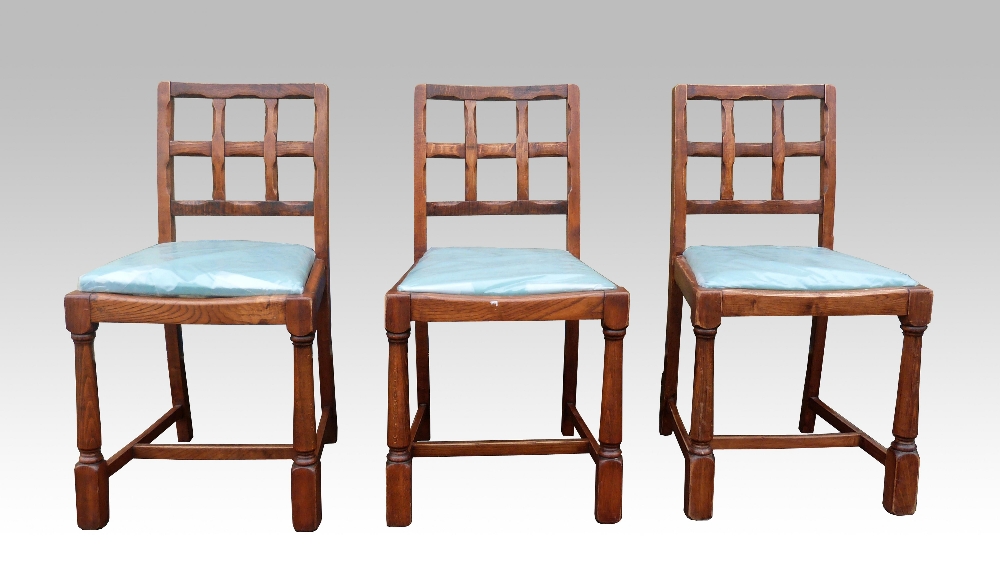 CHANGE OF ESTIMATE Set of six oak chairs in Cotswold school manner, the lattice backs with chamfered